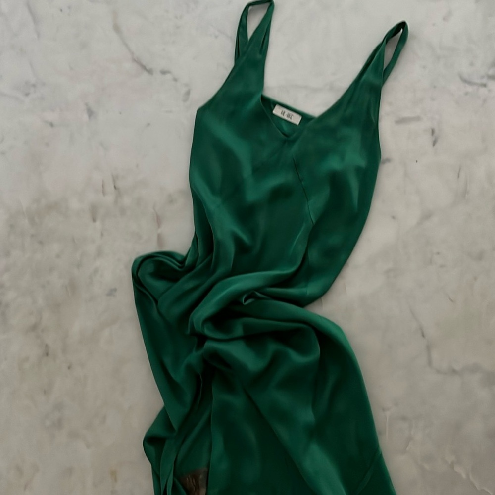 Emerald green dress made in Italy with two side slits and lace bottom